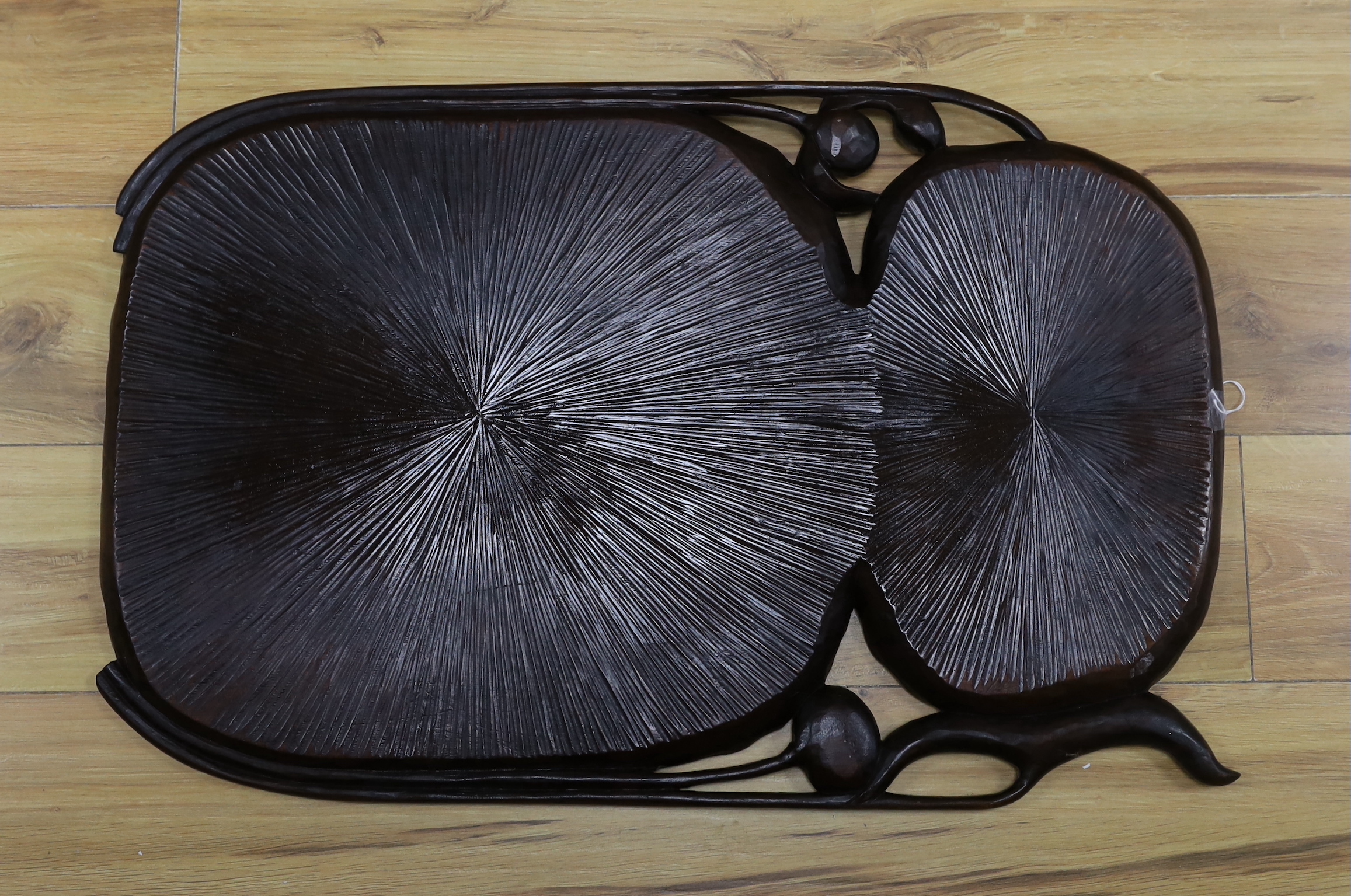 A Japanese carved hardwood lotus flower tray, 72cm wide